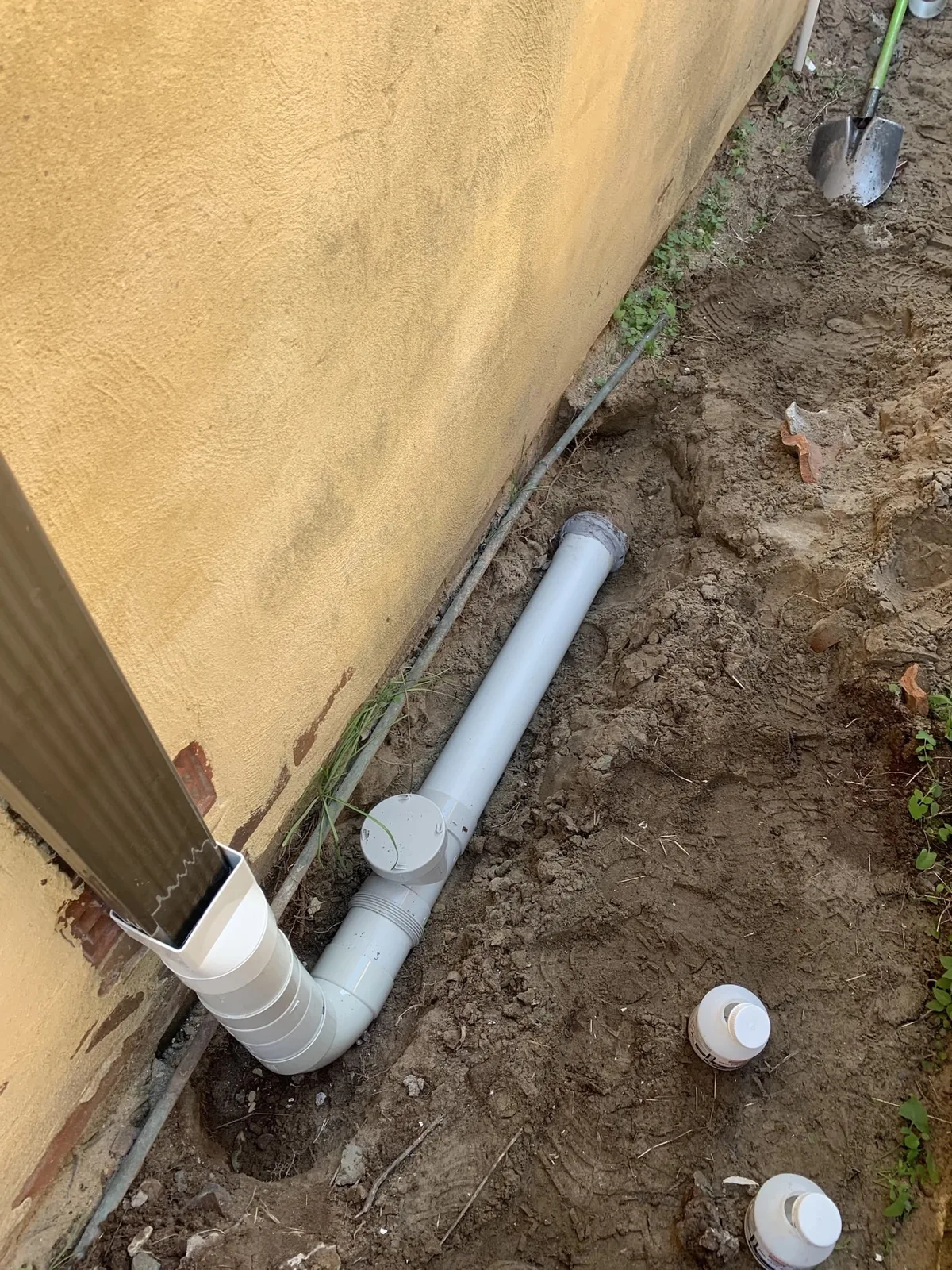 New stormwater downpipe drainage connected at the wall
