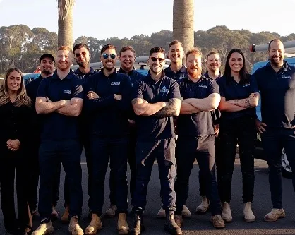 The local plumbing team lined up before the morning run